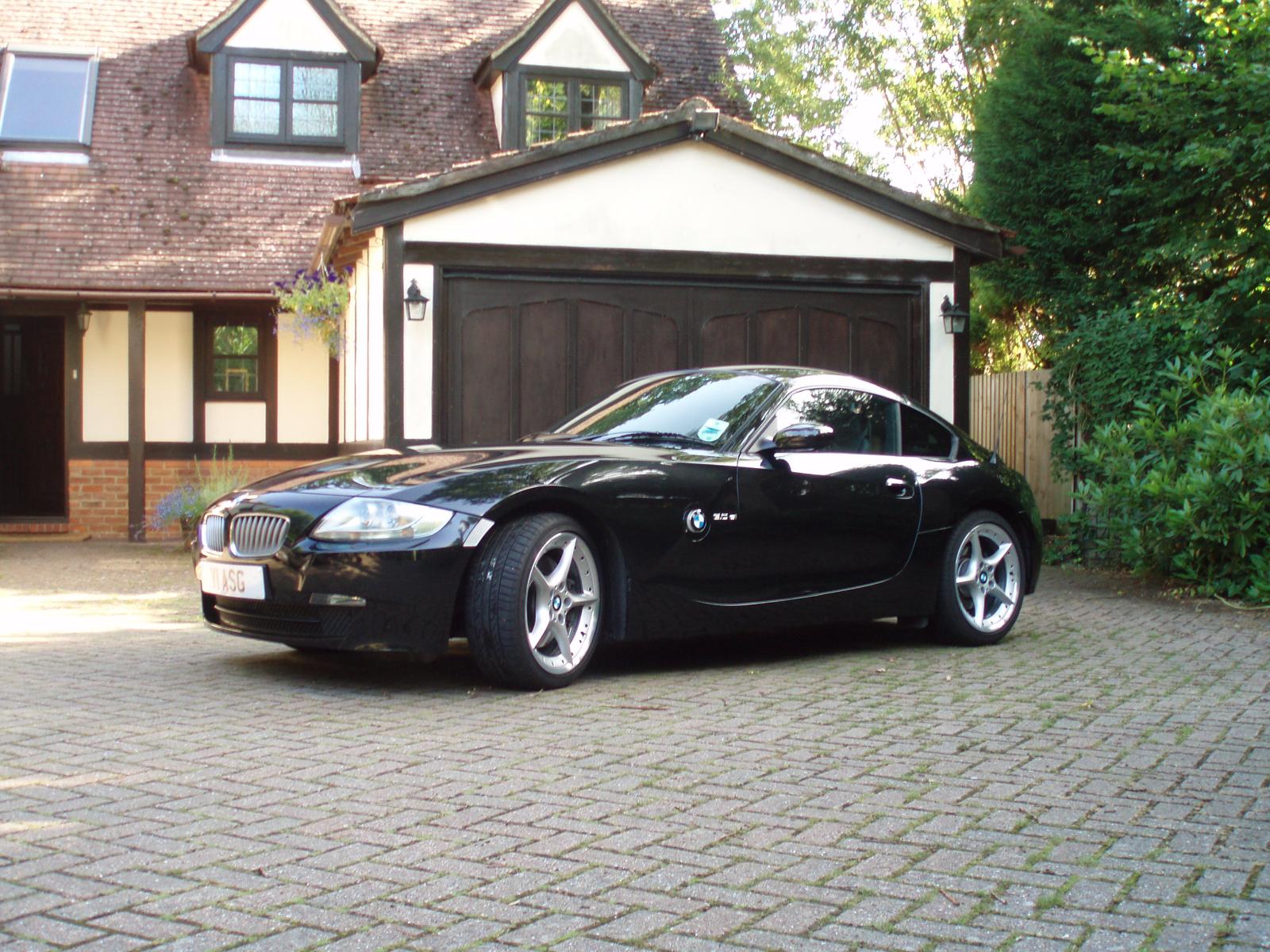 Black BMW E86 Z4 coupe viewed from the front on a driveway